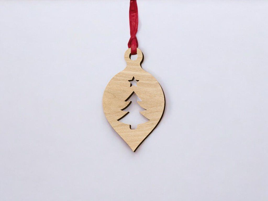 Laser Cut Oval Ornament with Christmas Tree and Star Vector