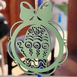 Laser Cut Mitten Christmas Ornament with Intricate Swirl Pattern