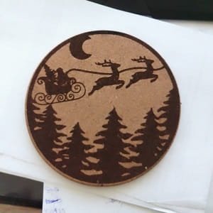 Laser Engraved Santa Sleigh and Flying Reindeer Over Forest Ornament